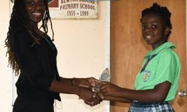 Faith Francis receives First Girl of Excellence Award  