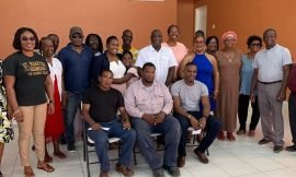 Three persons receive $6,000.00 cheques for medical expenses on Nevis